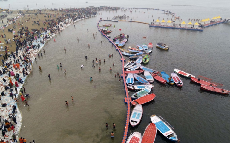 Devotees arriving at Prayagraj for the 2025 Mela