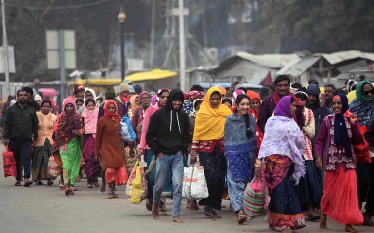 Devotees arrive at Prayagraj to dip in the Ganga River before Mahakumbh 2025